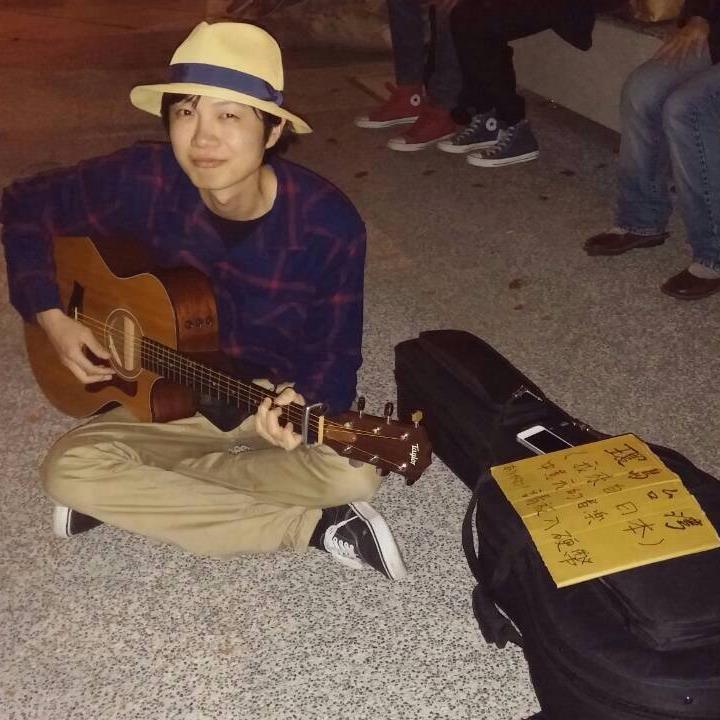 Takao playing guitar