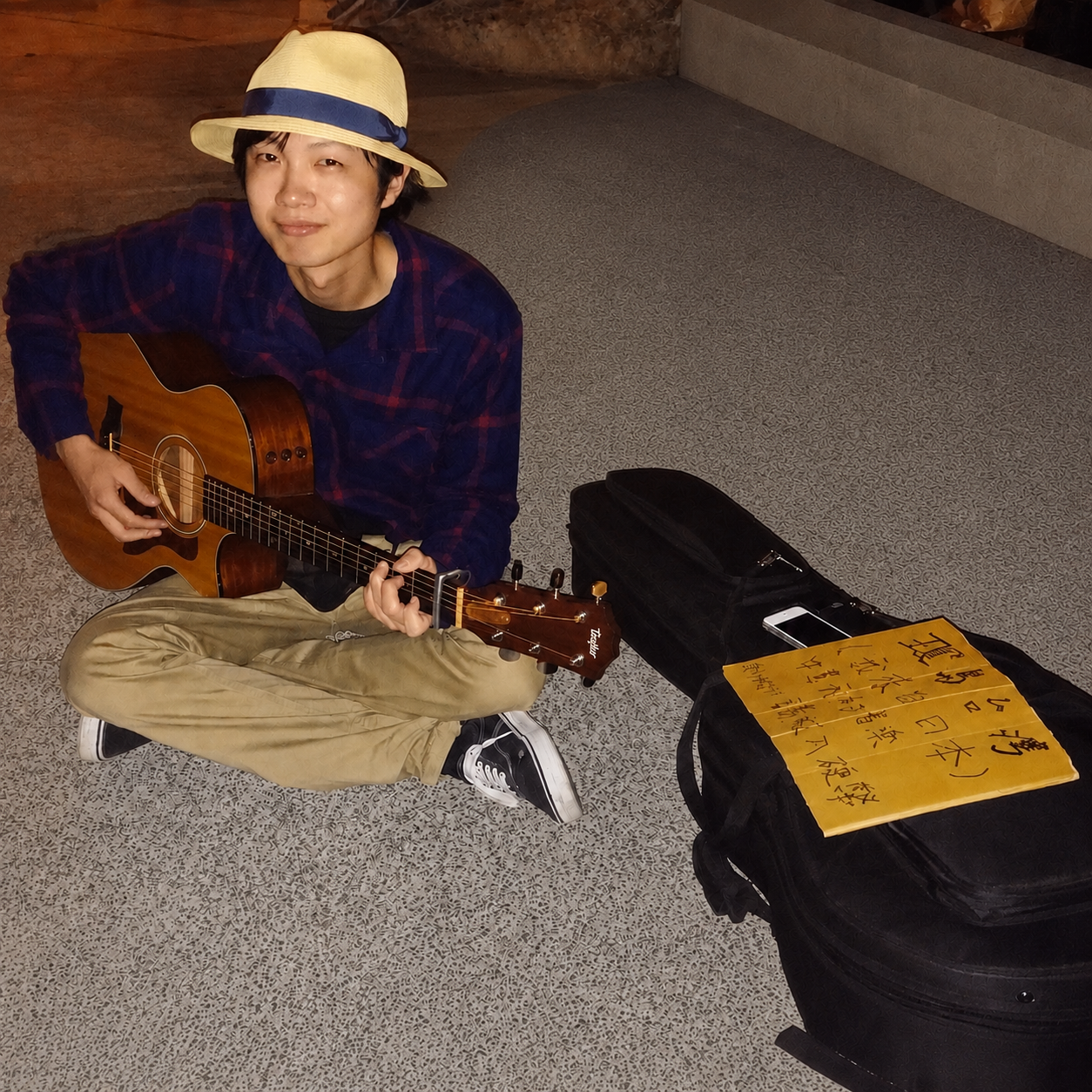 Takao playing guitar